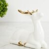 Home Centre White & Gold-Toned Ceramic Brighton Sitting Reindeer Figurine Showpiece